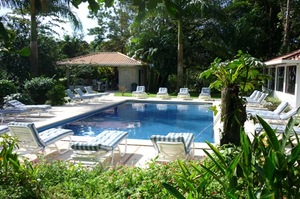 The main swimming pool is a large well maintained amenity surrounded by plenty of outdoor furnishings.